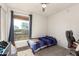 This bedroom has a window and natural light and is equipped with a ceiling fan and an air conditioning unit at 3 S 130Th Pl, Chandler, AZ 85225