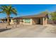 Single-story home with a carport and desert landscaping for low maintenance at 3 S 130Th Pl, Chandler, AZ 85225