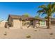Cozy single story home featuring a desert landscape and a beautiful palm tree at 3 S 130Th Pl, Chandler, AZ 85225
