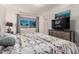 Comfortable main bedroom with dresser and media console, offering ample space and natural light at 3 S 130Th Pl, Chandler, AZ 85225