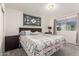 Cozy main bedroom featuring neutral-toned walls, plush carpet, and a king-sized bed, bathed in natural light at 3 S 130Th Pl, Chandler, AZ 85225