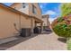 Relaxing backyard with covered patio, desert landscaping, and blooming bougainvillea at 3272 E Tyson St, Gilbert, AZ 85295