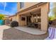 Backyard view highlighting covered patio, outdoor dining, and low-maintenance desert landscape at 3272 E Tyson St, Gilbert, AZ 85295