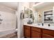 Bathroom with a single sink, a shower/tub combo, and a tile floor at 3272 E Tyson St, Gilbert, AZ 85295