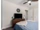 Bedroom with a flat-screen TV, neutral walls, and a ceiling fan at 3272 E Tyson St, Gilbert, AZ 85295