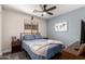 Bedroom with blue accent wall, decorative wall art, and a ceiling fan at 3272 E Tyson St, Gilbert, AZ 85295
