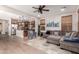 Open-concept living area features a large sectional, hardwood floors, and seamless access to the kitchen at 3272 E Tyson St, Gilbert, AZ 85295