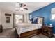 Bright main bedroom features a ceiling fan, neutral decor, and a large bed with plush bedding at 3272 E Tyson St, Gilbert, AZ 85295