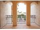 Balcony view showcases the meticulously landscaped yard of this property and neighbor's home beyond at 3306 E Jaeger Cir, Mesa, AZ 85213