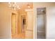 Elegant bathroom featuring a glass-enclosed shower and a chandelier at 3306 E Jaeger Cir, Mesa, AZ 85213