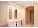 Elegant bathroom vanity with marble countertops and a chandelier at 3306 E Jaeger Cir, Mesa, AZ 85213