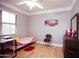 Comfortable bedroom with wood floors, a bright window, and plenty of space to relax at 3306 E Jaeger Cir, Mesa, AZ 85213