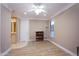 This is a spacious bedroom with wood floors and a view into an on-suite bathroom at 3306 E Jaeger Cir, Mesa, AZ 85213