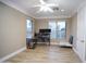 Large bedroom with wood flooring and a ceiling fan with great natural lighting at 3306 E Jaeger Cir, Mesa, AZ 85213