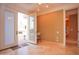 This bedroom boasts tiled floors, recessed lighting, and exterior access to a beautiful porch area at 3306 E Jaeger Cir, Mesa, AZ 85213