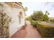 Well-manicured landscaping along the side of this home provides curb appeal and a peaceful view at 3306 E Jaeger Cir, Mesa, AZ 85213