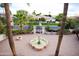 Expansive home with a statue in the front yard framed by palm trees and well-maintained landscaping at 3306 E Jaeger Cir, Mesa, AZ 85213
