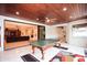 Game room featuring a ping pong table, wood ceiling, and sliding glass doors to the outside at 3306 E Jaeger Cir, Mesa, AZ 85213