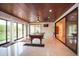 Bright game room featuring a ping pong table, wood ceiling, and access to outdoor green space at 3306 E Jaeger Cir, Mesa, AZ 85213