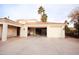 Attached three car garage offering ample space for vehicles and storage with beautiful tile roof at 3306 E Jaeger Cir, Mesa, AZ 85213