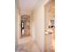 Hallway that leads to the kitchen, featuring tile floors at 3306 E Jaeger Cir, Mesa, AZ 85213