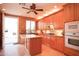 Traditional kitchen with custom cabinets, granite countertops, stainless steel appliances, and tile backsplash at 3306 E Jaeger Cir, Mesa, AZ 85213
