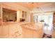 Gourmet kitchen with a large island and views into other rooms at 3306 E Jaeger Cir, Mesa, AZ 85213