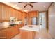 Bright kitchen features an island, stainless appliances, and granite countertops and is move-in ready at 3306 E Jaeger Cir, Mesa, AZ 85213