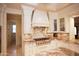 Kitchen with stainless steel stove and custom cabinets at 3306 E Jaeger Cir, Mesa, AZ 85213