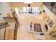 Open-concept living room with marble floors, fireplace, and staircase at 3306 E Jaeger Cir, Mesa, AZ 85213