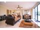 Bright living room with tile floors and sliding glass doors to bring the outside in at 3306 E Jaeger Cir, Mesa, AZ 85213