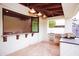 Covered outdoor kitchen and bar area with modern appliances at 3306 E Jaeger Cir, Mesa, AZ 85213