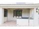 An outdoor kitchen with a built-in BBQ grill, sink, and counter space on a patio at 3306 E Jaeger Cir, Mesa, AZ 85213
