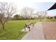 Community park featuring a bench and trees, providing a peaceful outdoor space for relaxation and recreation at 3306 E Jaeger Cir, Mesa, AZ 85213