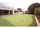 Backyard putting green with a shed in a beautifully landscaped backyard at 3306 E Jaeger Cir, Mesa, AZ 85213