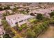 Aerial view showcases the home's putting green, citrus trees, and covered patio, perfect for entertaining at 3306 E Jaeger Cir, Mesa, AZ 85213