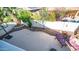 Aerial view of a private backyard with a spacious patio, lounge chairs, and lush green landscaping at 3411 S Vine St, Chandler, AZ 85248