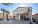 Backyard featuring a covered patio, pool, outdoor seating, and lush landscaping, perfect for entertaining at 3411 S Vine St, Chandler, AZ 85248