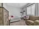 Inviting bedroom with soft lighting, neutral walls, carpet, and a cozy armchair, great for relaxation at 3411 S Vine St, Chandler, AZ 85248