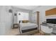 Well-lit bedroom with large windows, stylish decor, neutral paint, and a ceiling fan at 3411 S Vine St, Chandler, AZ 85248