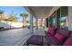 Relaxing covered patio with comfortable seating, views of the pool, and a lush backyard landscape at 3411 S Vine St, Chandler, AZ 85248