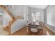 Bright dining area with wood floors, high ceilings, dining table and a nearby staircase at 3411 S Vine St, Chandler, AZ 85248