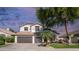 Charming home with a three-car garage, landscaped yard, and beautiful desert plants at 3411 S Vine St, Chandler, AZ 85248