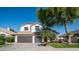 A nice two story home with a three car garage, lush green lawn, and nice landscaping at 3411 S Vine St, Chandler, AZ 85248