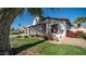Charming home featuring manicured landscaping, mature trees, and cozy front porch seating area at 3411 S Vine St, Chandler, AZ 85248