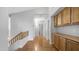 Second story hallway with beautiful wood floors and custom storage cabinets at 3411 S Vine St, Chandler, AZ 85248