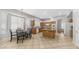 Open kitchen featuring tile floors, modern appliances, kitchen island, and breakfast table at 3411 S Vine St, Chandler, AZ 85248