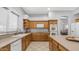 Bright kitchen with center island, built-in appliances, and ample cabinetry for storage at 3411 S Vine St, Chandler, AZ 85248