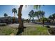 Neighborhood street scape with a lake view, lush green lawns, and manicured landscape at 3411 S Vine St, Chandler, AZ 85248