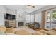 Comfortable living room with a fireplace, large windows, and a sliding glass door at 3411 S Vine St, Chandler, AZ 85248